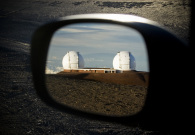 The twin Keck telescopes as seen from a car mirror on the summit. - Pablo McLoud