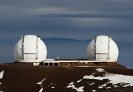 The twin Keck domes sitting atop a snow frosted Mauna Kea summit. - Pablo McLoud