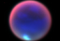 This image of Saturn’s giant moon Titan is a composite of three infrared bands captured by the Near Infrared Camera-2 on the 10-meter Keck II telescope. It was taken by astronomer Antonin Bouchez on June 7, 2011. Each infrared band was assigned a color: red, green and blue. The three were then merged to make this false-color image. The brightening at the limb of the moon is probably due to the thicker amount of atmosphere that is being viewed at such an oblique angle. - Antonin Bouchez, W.M. Keck Observatory