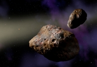 Artist rendering of binary asteroid (617) Patroclus. Scientists at UC Berkeley think this system may have formed from an ancient comet several billion years in the past. The gravitational pull of Jupiter may have split the object in half, resulting in two, almost equal pieces. - Artist Illustration by Lynette Cook