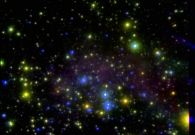 The central starburst region of the dwarf galaxy IC 10. In this composite color image, near infrared images obtained with the Keck II telescope have been combined with visible-light images taken with NASA’s Hubble Space Telescope to reveal distinct populations of red and blue stars. - UC Berkeley/NASA/W. M. Keck Observatory
